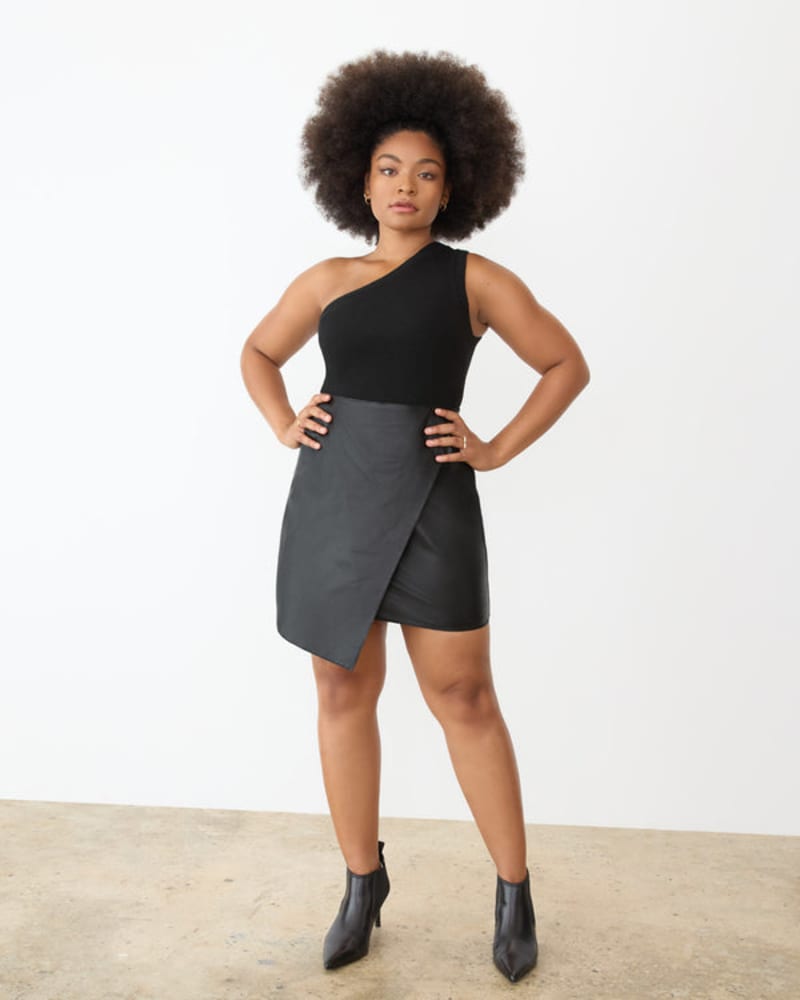 Front of a model wearing a size XL Leather Wrap Mini Skirt in Black Beauty by GSTQ. | dia_product_style_image_id:243731